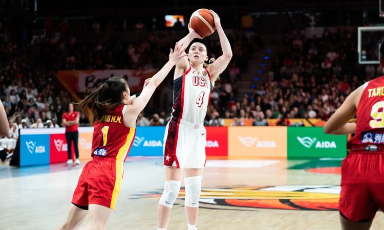 United States guard Paige Bueckers, No. 4, rises for a jump shot over a China defender.
