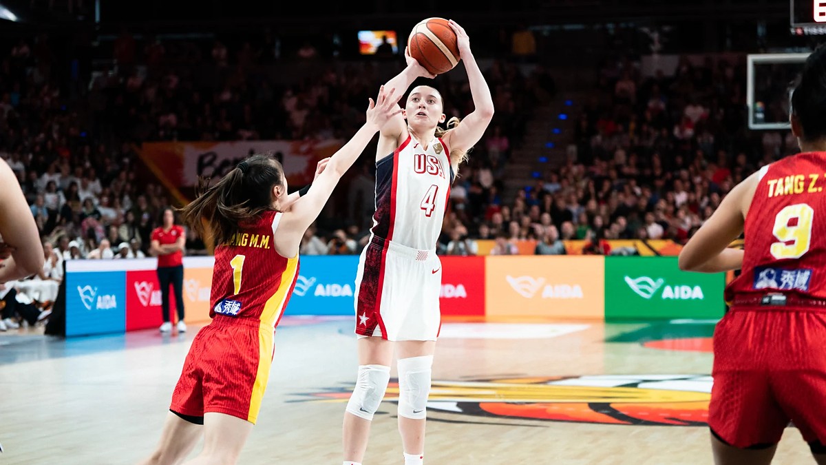 United States guard Paige Bueckers, No. 4, rises for a jump shot over a China defender.