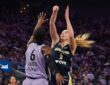 Dallas Wings guard Paige Bueckers rises for a jump shot over Golden State Valkyries guard-forward Kaila Charles.