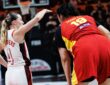 United States guard Paige Bueckers, No. 4, gestures beside China center Zhang Ziyu, No. 19, during a stoppage.