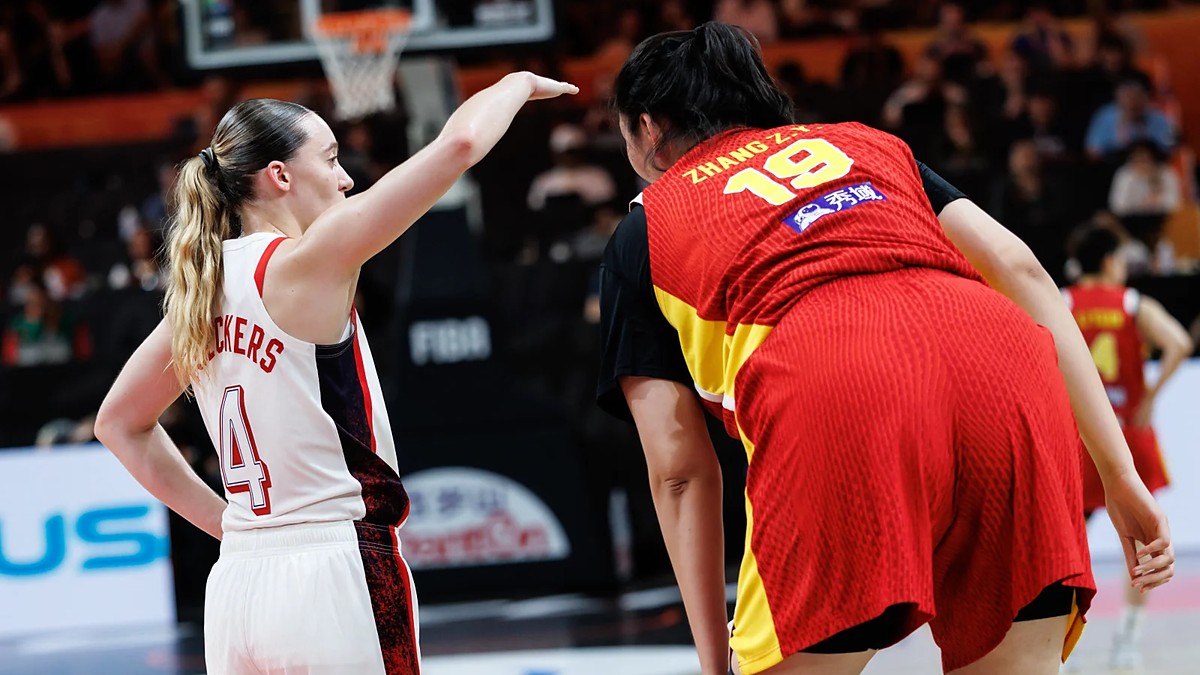 United States guard Paige Bueckers, No. 4, gestures beside China center Zhang Ziyu, No. 19, during a stoppage.