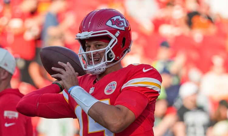 Kansas City Chiefs quarterback Patrick Mahomes cocks the ball to throw during warmups before a game against the Seahawks.