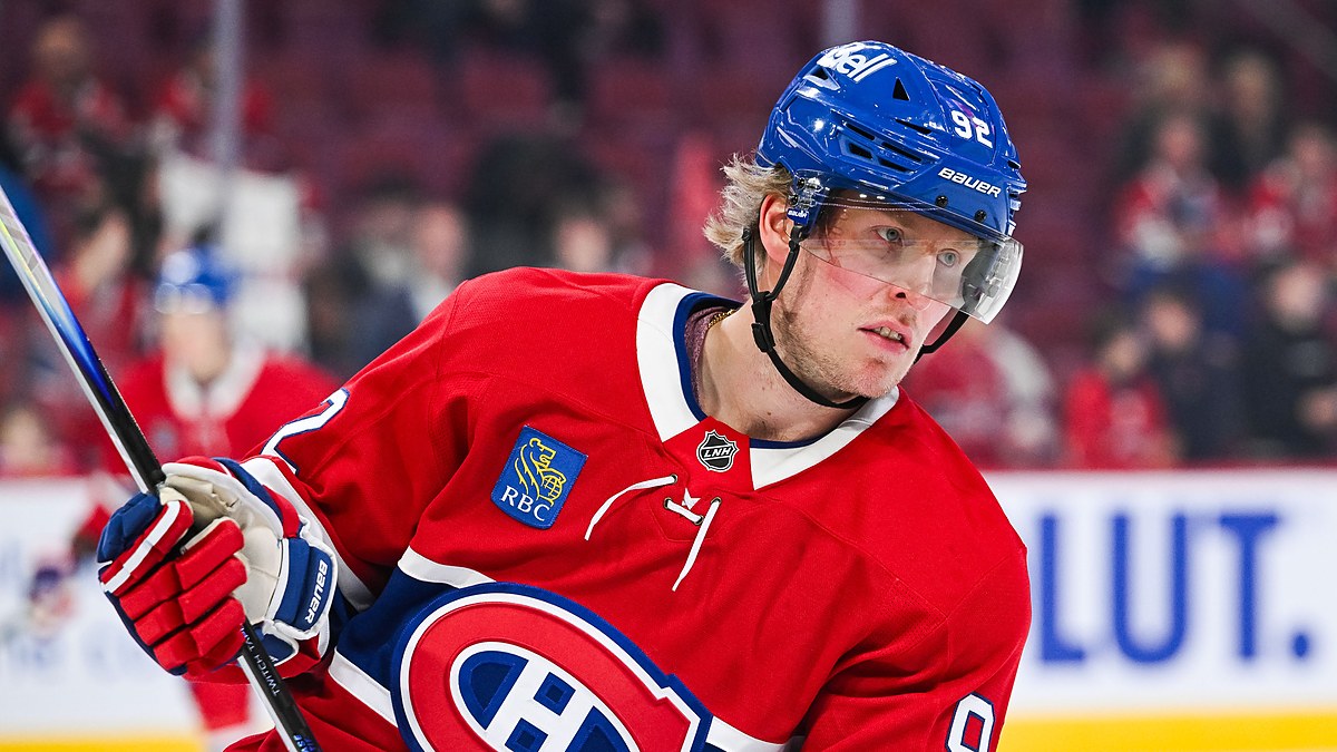 Montreal Canadiens right wing Patrik Laine holds his stick during warmups in a red home sweater.