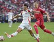 FC Dallas forward Petar Musa strikes the ball as St. Louis CITY SC defender Timo Baumgartl closes in.