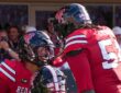 Texas Tech's Quinten Joyner and Jordan Church face each other helmet to helmet celebrating a touchdown.