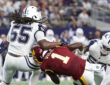 Dallas Cowboys linebackers Jaishawn Barham and Dee Winters wrap up Washington Commanders running back Rachaad White.