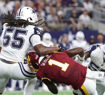 Dallas Cowboys linebackers Jaishawn Barham and Dee Winters wrap up Washington Commanders running back Rachaad White.