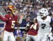 Washington Commanders quarterback Jayden Daniels throws a pass as Cowboys linebacker Rashan Gary rushes toward him.