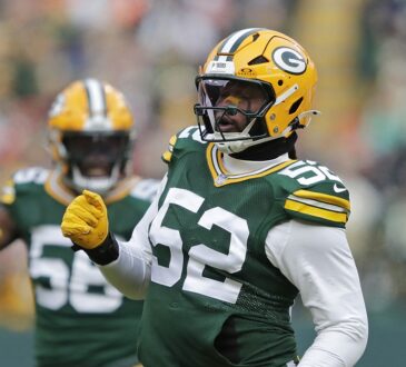 Green Bay Packers defensive end Rashan Gary pumps a fist in celebration after sacking Bears quarterback Caleb Williams.