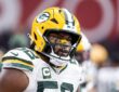 Green Bay Packers defensive lineman Rashan Gary looks toward the sideline in his helmet before a game against the Cardinals.