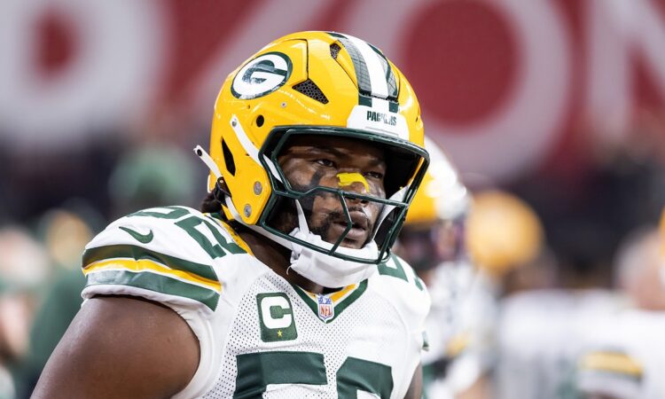 Green Bay Packers defensive lineman Rashan Gary looks toward the sideline in his helmet before a game against the Cardinals.