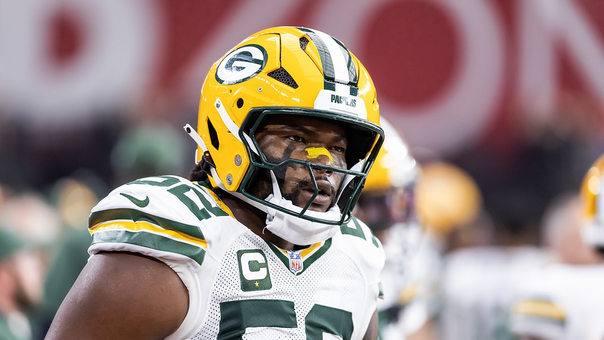 Green Bay Packers defensive lineman Rashan Gary looks toward the sideline in his helmet before a game against the Cardinals.