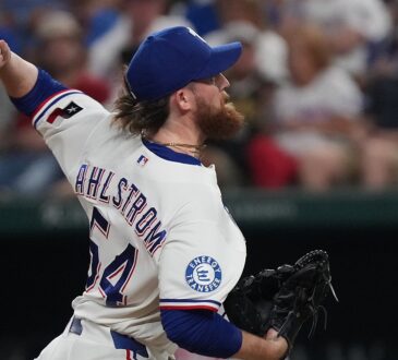 Texas Rangers pitcher Robby Ahlstrom reaches back with the ball as he throws to the plate against Boston.
