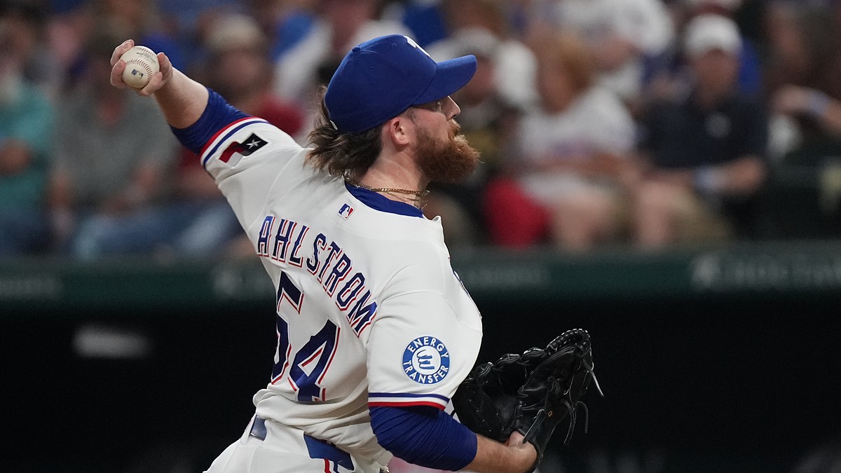 Texas Rangers pitcher Robby Ahlstrom reaches back with the ball as he throws to the plate against Boston.