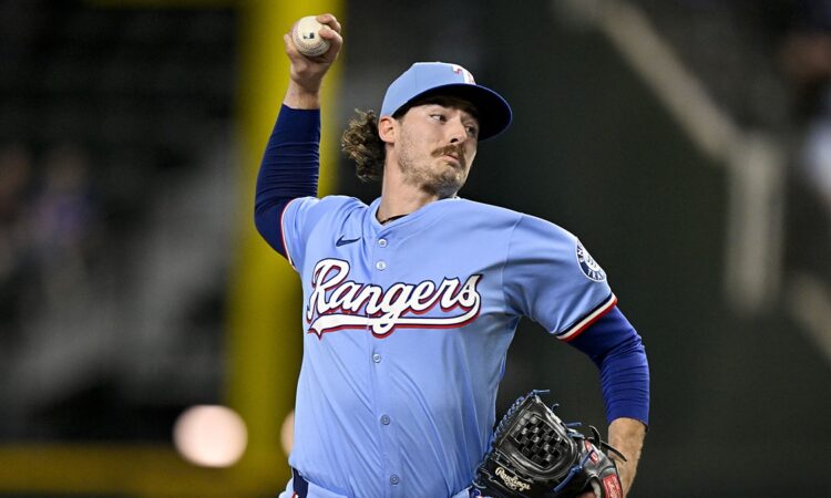 Texas Rangers relief pitcher Robert Garcia raises the ball in his delivery during a game against the Marlins.