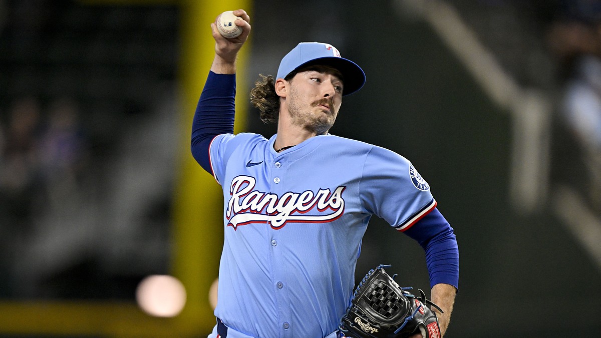 Texas Rangers relief pitcher Robert Garcia raises the ball in his delivery during a game against the Marlins.