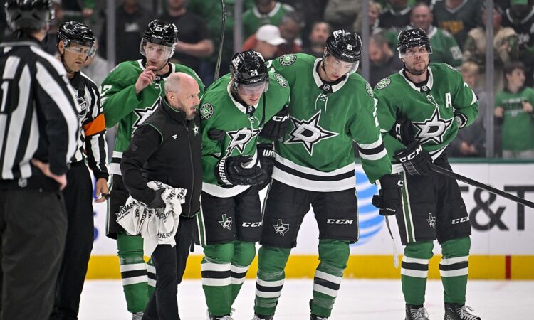 Dallas Stars center Roope Hintz is helped off the ice by teammates after an injury at American Airlines Center.