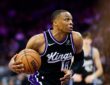 Sacramento Kings guard Russell Westbrook drives with the ball in a black home uniform at Golden 1 Center.