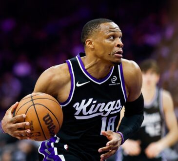 Sacramento Kings guard Russell Westbrook drives with the ball in a black home uniform at Golden 1 Center.