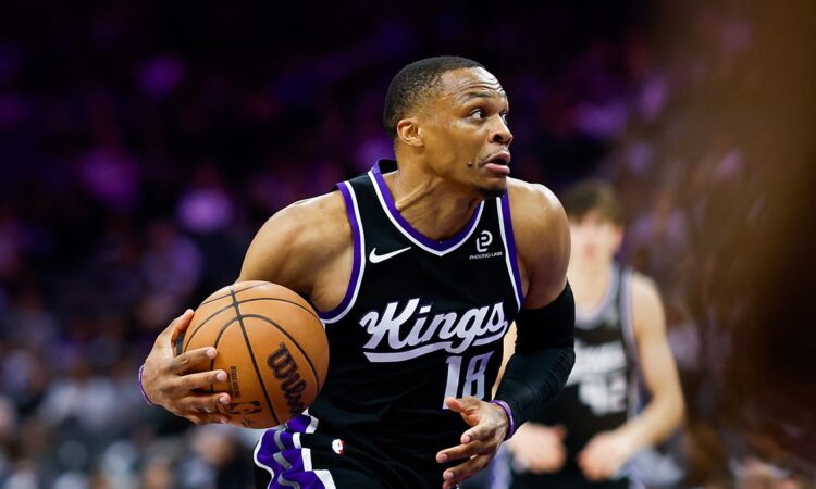 Sacramento Kings guard Russell Westbrook drives with the ball in a black home uniform at Golden 1 Center.