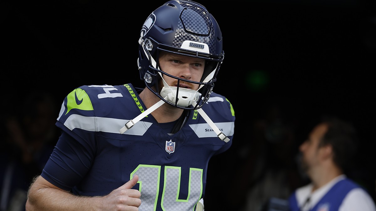 Seattle Seahawks quarterback Sam Darnold jogs out of the tunnel for warmups before a game against the Patriots.
