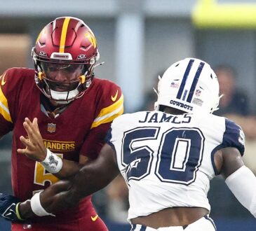 Washington Commanders quarterback Jayden Daniels loses the football as Dallas Cowboys linebacker Shemar James reaches in.