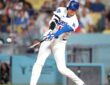 Los Angeles Dodgers batter Shohei Ohtani makes contact with a pitch during a game against the Cardinals.