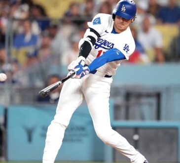 Los Angeles Dodgers batter Shohei Ohtani makes contact with a pitch during a game against the Cardinals.