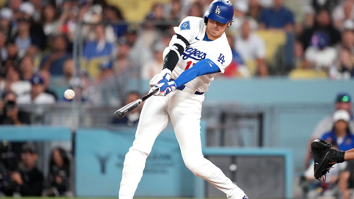 Los Angeles Dodgers batter Shohei Ohtani makes contact with a pitch during a game against the Cardinals.