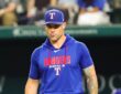 Texas Rangers manager Skip Schumaker walks toward the mound during a game against Boston.