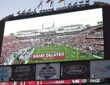 A stadium videoboard reads Game Delayed, Power Outage above a kickoff countdown before SMU plays Florida State.