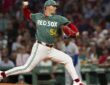 Boston Red Sox pitcher Sonny Gray strides toward the plate with the ball raised as he delivers against Kansas City.
