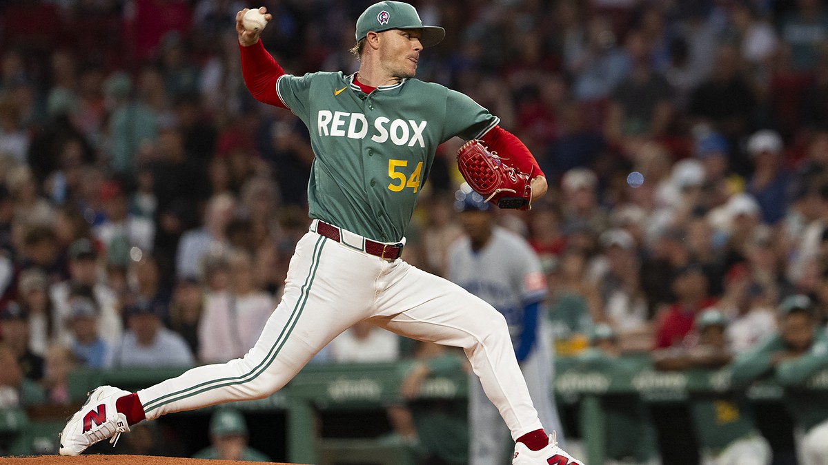 Boston Red Sox pitcher Sonny Gray strides toward the plate with the ball raised as he delivers against Kansas City.