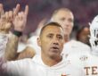 Texas Longhorns head coach Steve Sarkisian raises the Hook ’em Horns hand sign after the game against Georgia.