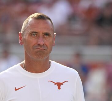 Texas Longhorns head coach Steve Sarkisian watches warmups on the field before facing Ohio State in Austin.