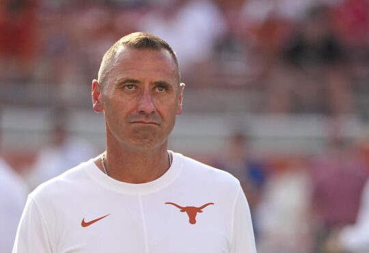 Texas Longhorns head coach Steve Sarkisian watches warmups on the field before facing Ohio State in Austin.