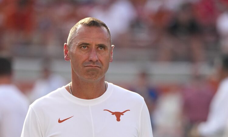 Texas Longhorns head coach Steve Sarkisian watches warmups on the field before facing Ohio State in Austin.