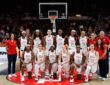 The United States women's basketball team poses for a team photo at center court before a World Cup game.