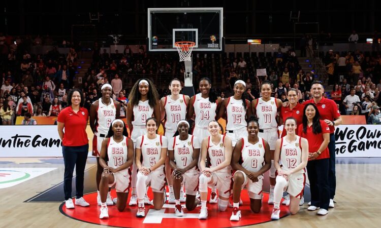 The United States women's basketball team poses for a team photo at center court before a World Cup game.