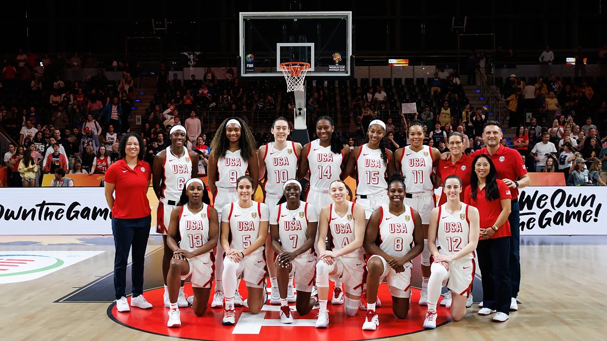 The United States women's basketball team poses for a team photo at center court before a World Cup game.