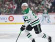 Stars defenseman Thomas Harley skates up ice with the puck on his stick against the Wild.