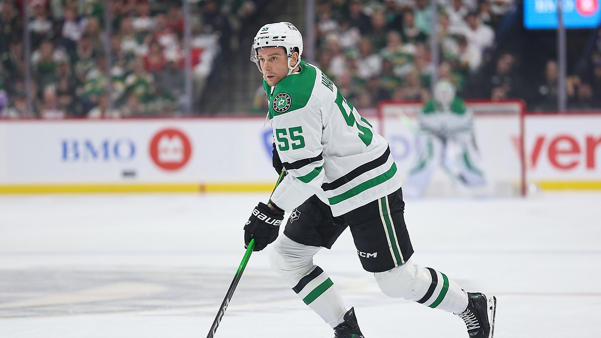 Stars defenseman Thomas Harley skates up ice with the puck on his stick against the Wild.