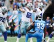 Dallas Cowboys guard T.J. Bass points and calls out an assignment at the line of scrimmage against the Panthers.