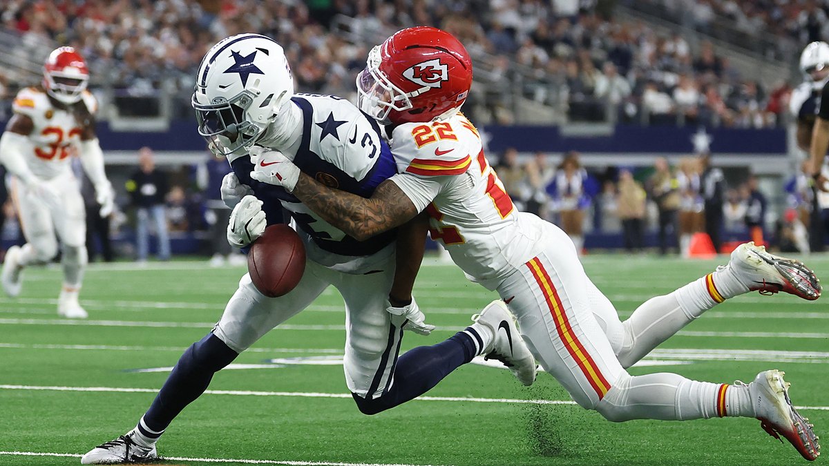Kansas City Chiefs cornerback Trent McDuffie wraps up Dallas Cowboys wide receiver George Pickens as the ball pops loose.