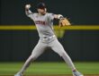 Boston Red Sox shortstop Trevor Story sets his feet and throws to first base during a game at Globe Life Field.
