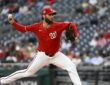 Washington Nationals starting pitcher Trevor Williams throws in his red home uniform at Nationals Park.