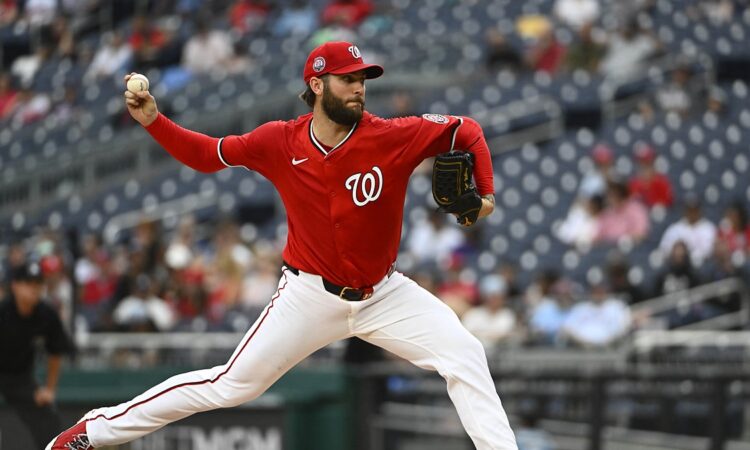 Washington Nationals starting pitcher Trevor Williams throws in his red home uniform at Nationals Park.