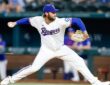 Texas Rangers right-hander Trevor Williams, No. 51, delivers a pitch from the mound at Globe Life Field.