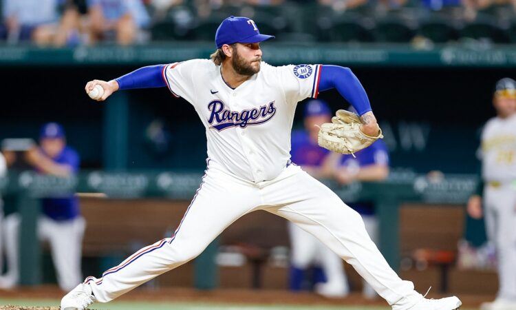 Texas Rangers right-hander Trevor Williams, No. 51, delivers a pitch from the mound at Globe Life Field.