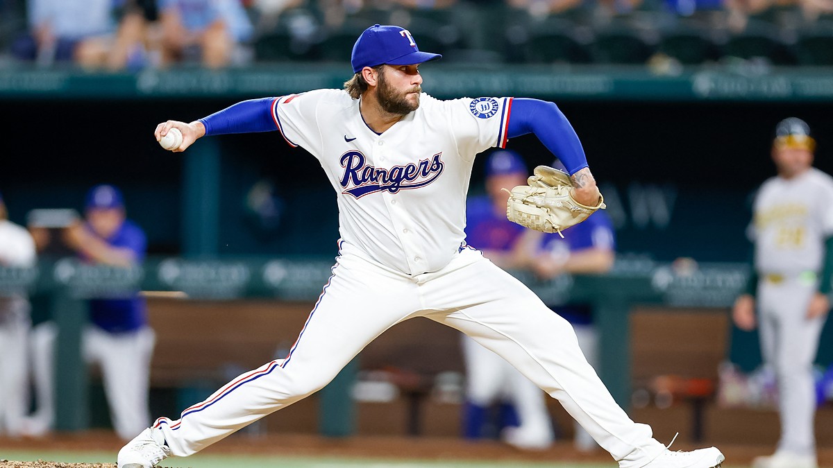 Texas Rangers right-hander Trevor Williams, No. 51, delivers a pitch from the mound at Globe Life Field.